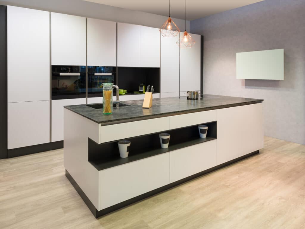 modern flat white kitchen with cooking island and tv